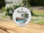 Round ornament with "Maldives 2026" and watercolor overwater bungalows.