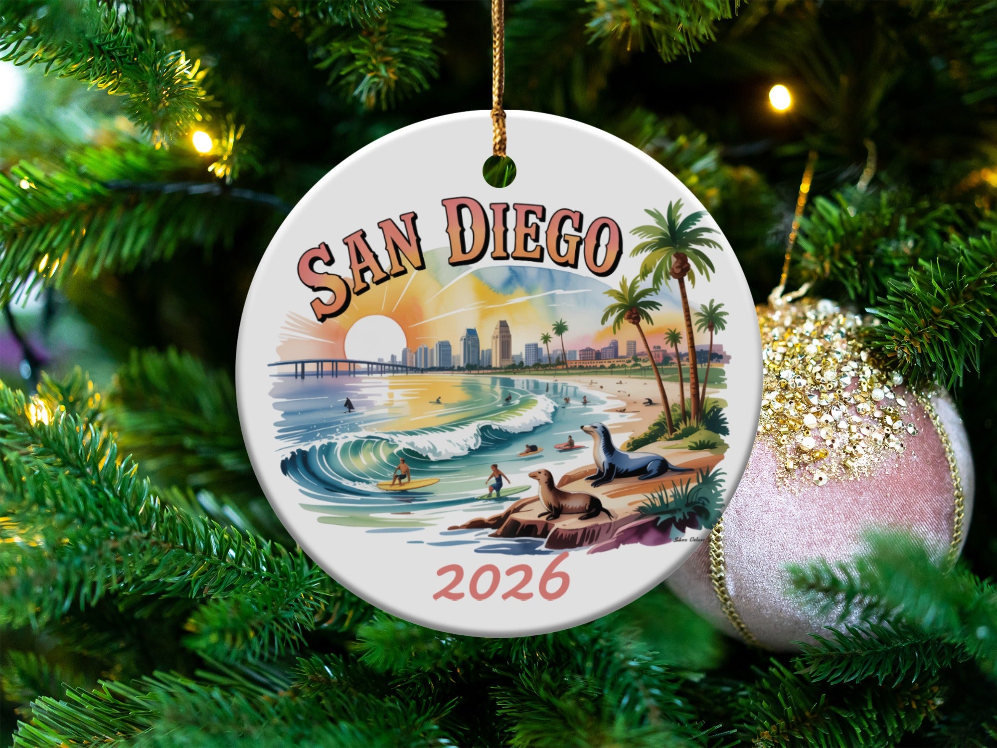 San Diego round ceramic ornament with beach scene and palm trees.