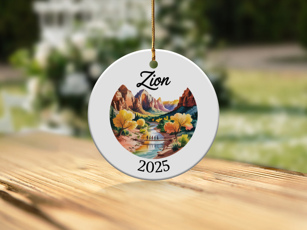 Round ornament depicting Zion National Park with river and trees, dated 2025.