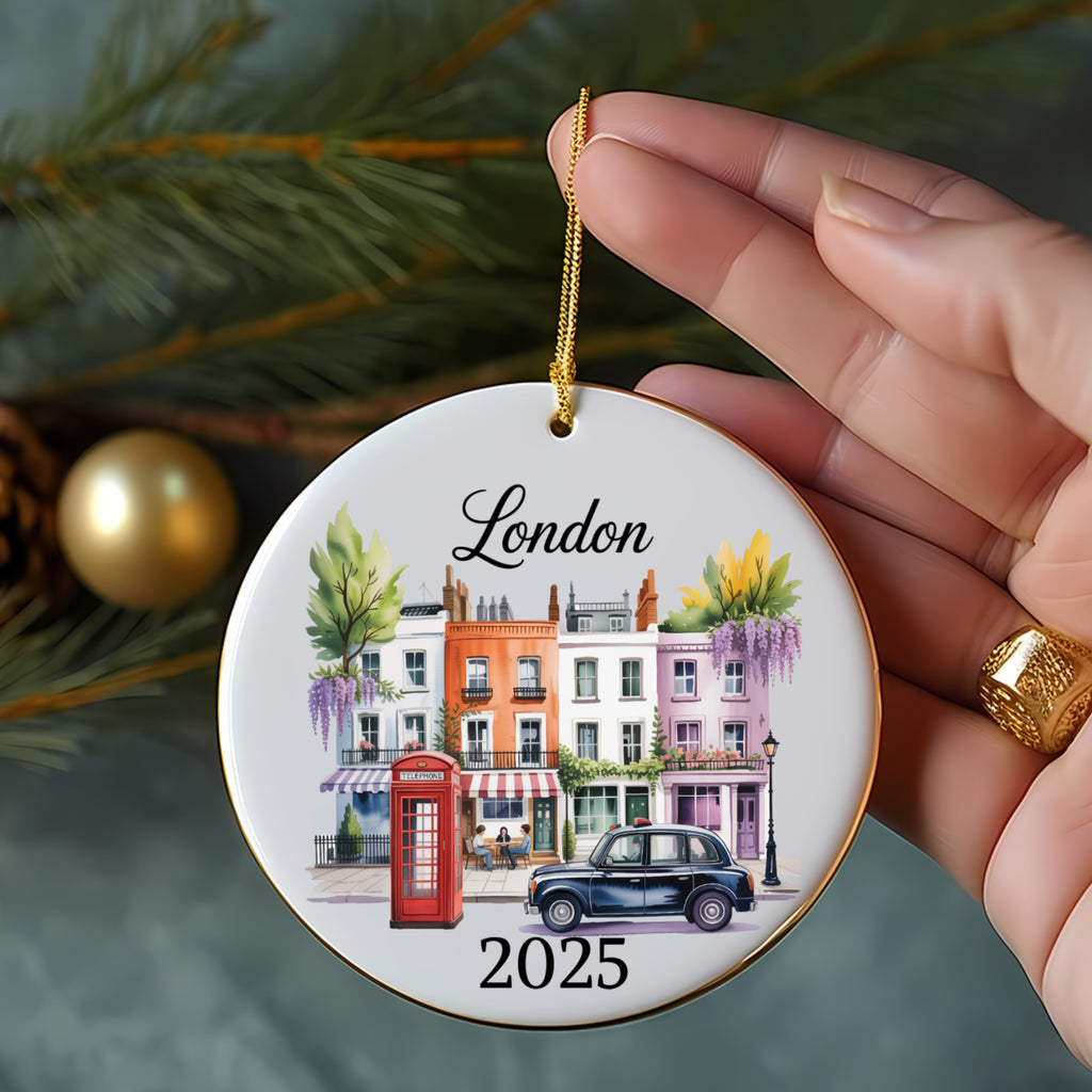 Round ceramic ornament with "London" and a street scene with iconic red phone booth.