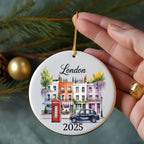 Round ceramic ornament with "London" and a street scene with iconic red phone booth.