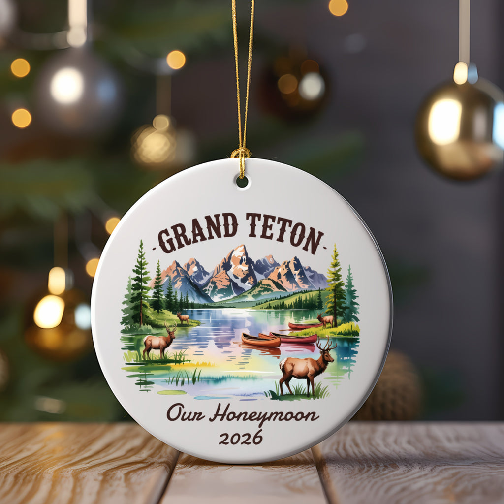 Round ornament with Grand Teton mountains, lake, canoes, and deer; 2026.