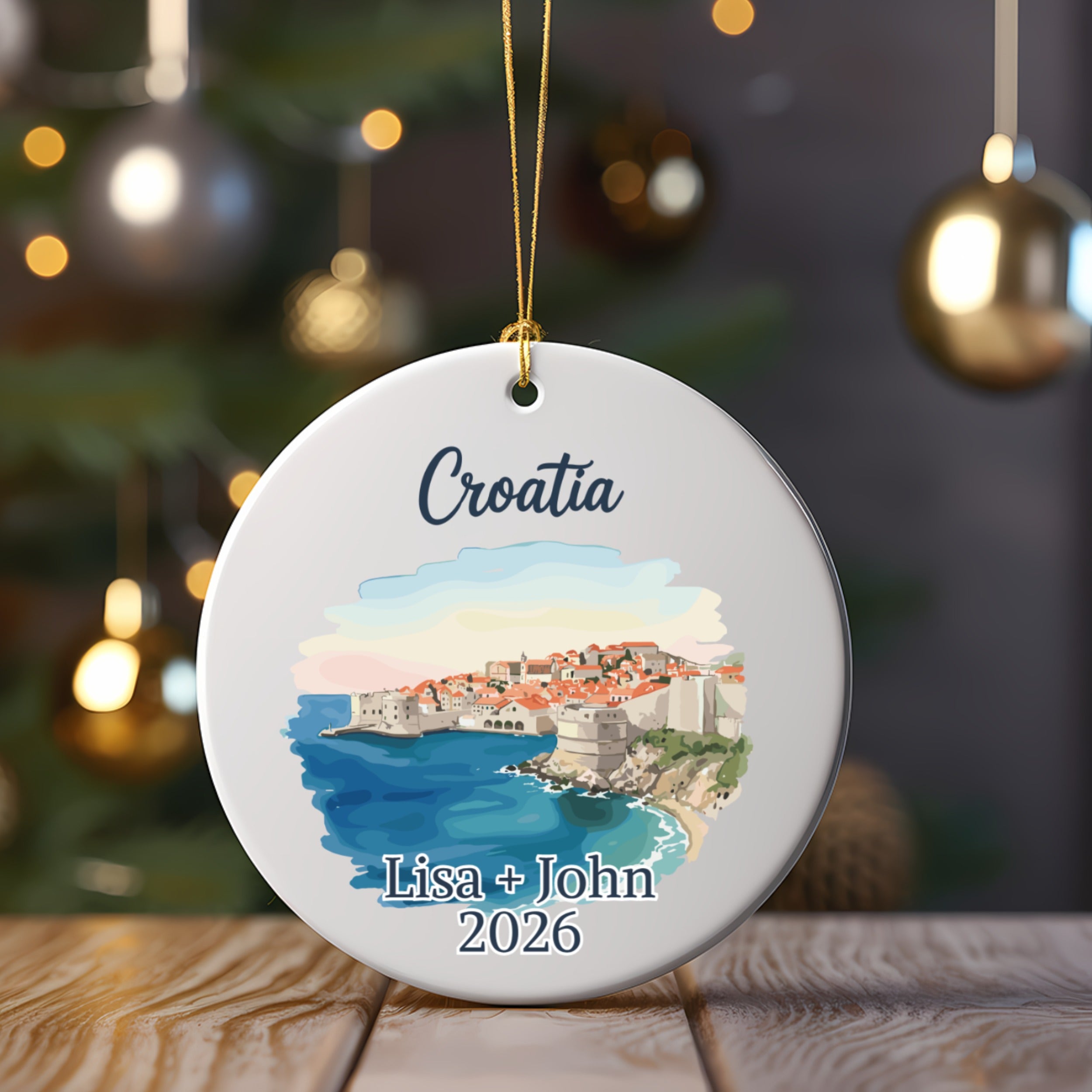 Round ornament with watercolor of Dubrovnik, Croatia and custom names and year.