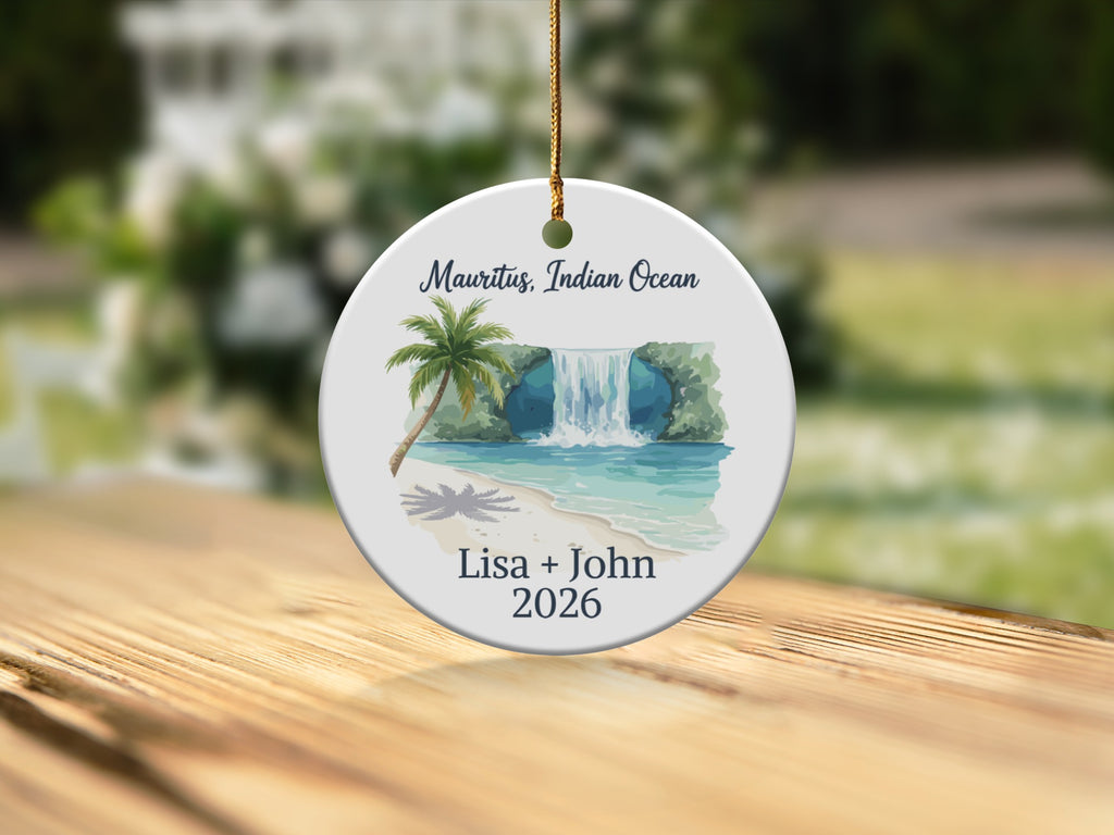 Circular ornament with a tropical waterfall scene and personalized text.