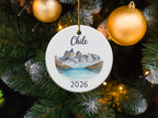 Round ornament with Chilean mountain landscape and "2026" text.