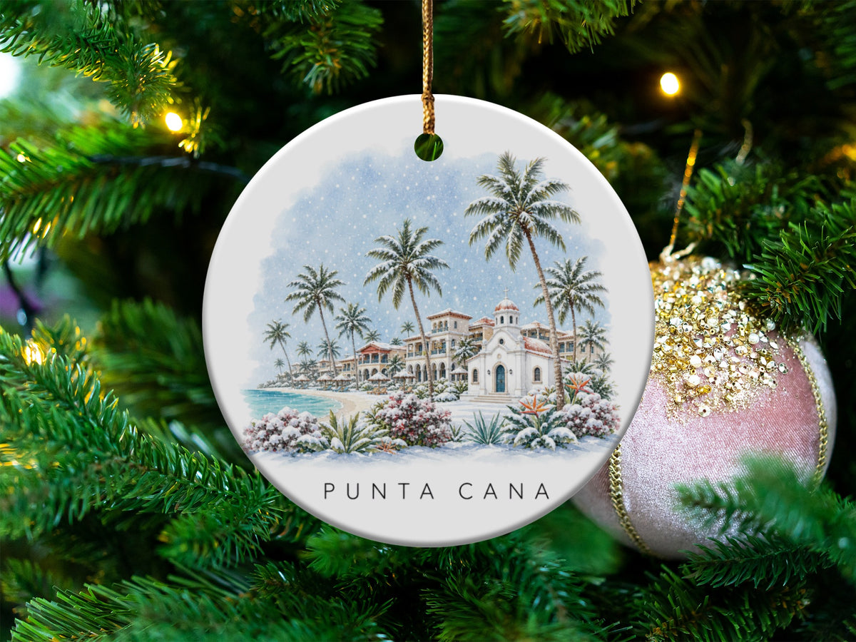 Round ornament with Punta Cana beach scene and snow falling.
