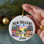 New Orleans 2026 ceramic ornament with colorful buildings and a boat.