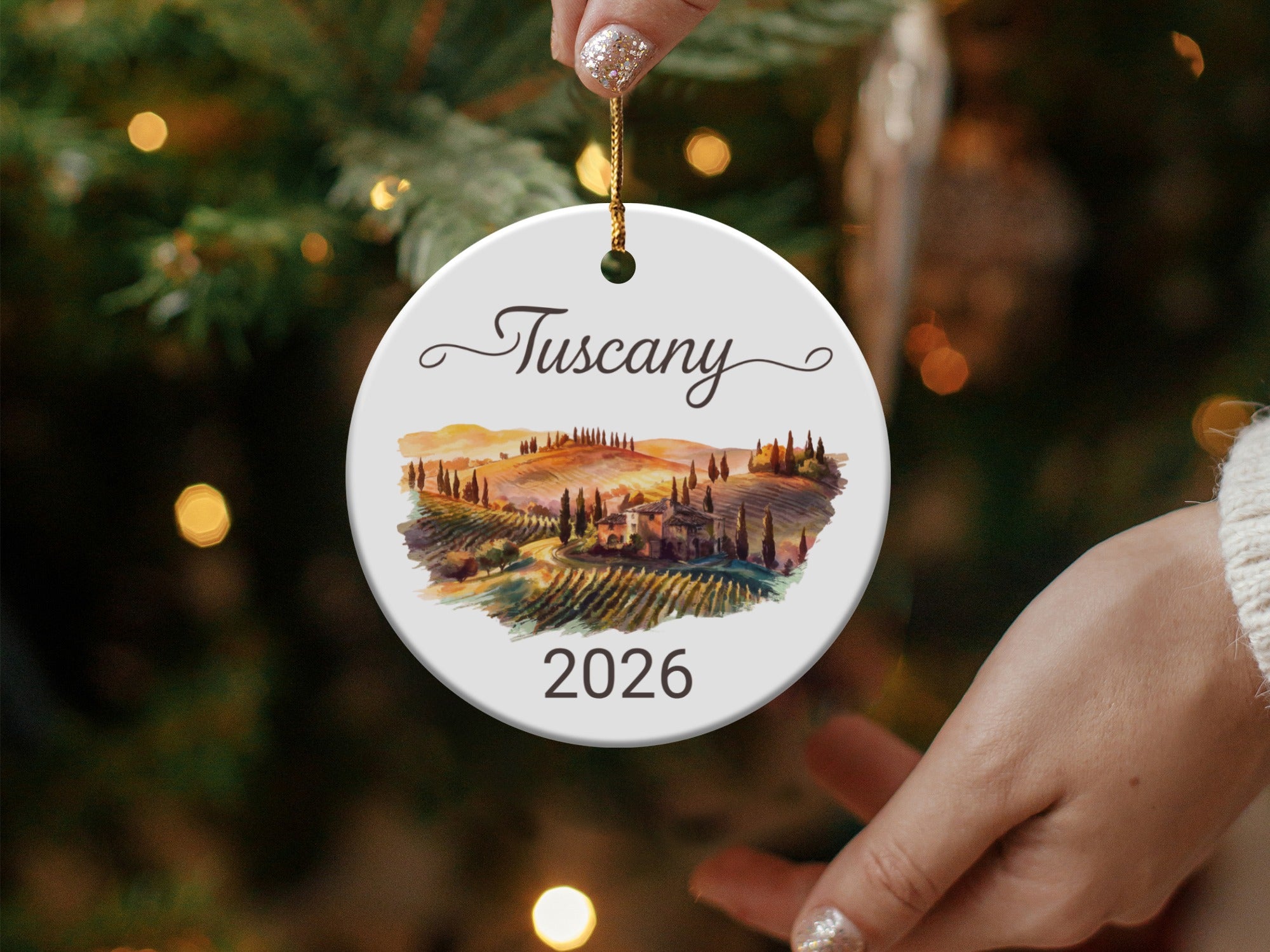 Tuscany 2026 ceramic ornament with rolling hills and cypress trees.