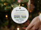 Round ornament with Geneva, Switzerland skyline and text "Lisa + John 2026".