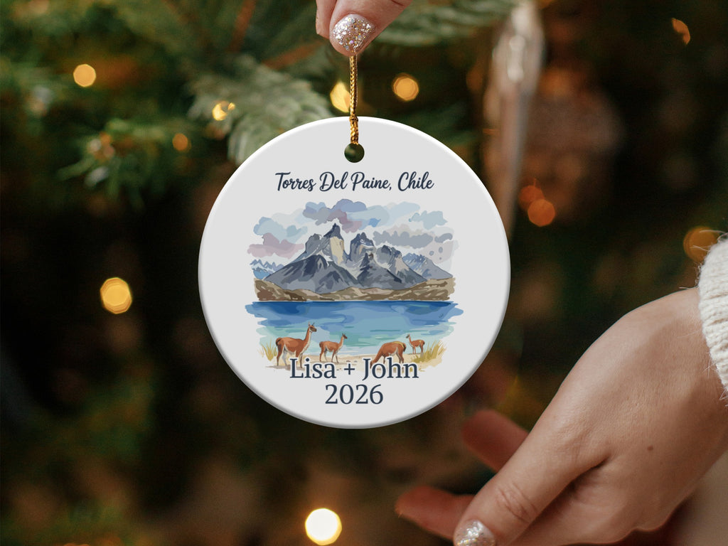 Torres del Paine, Chile ceramic ornament with mountains, lake, and guanacos.