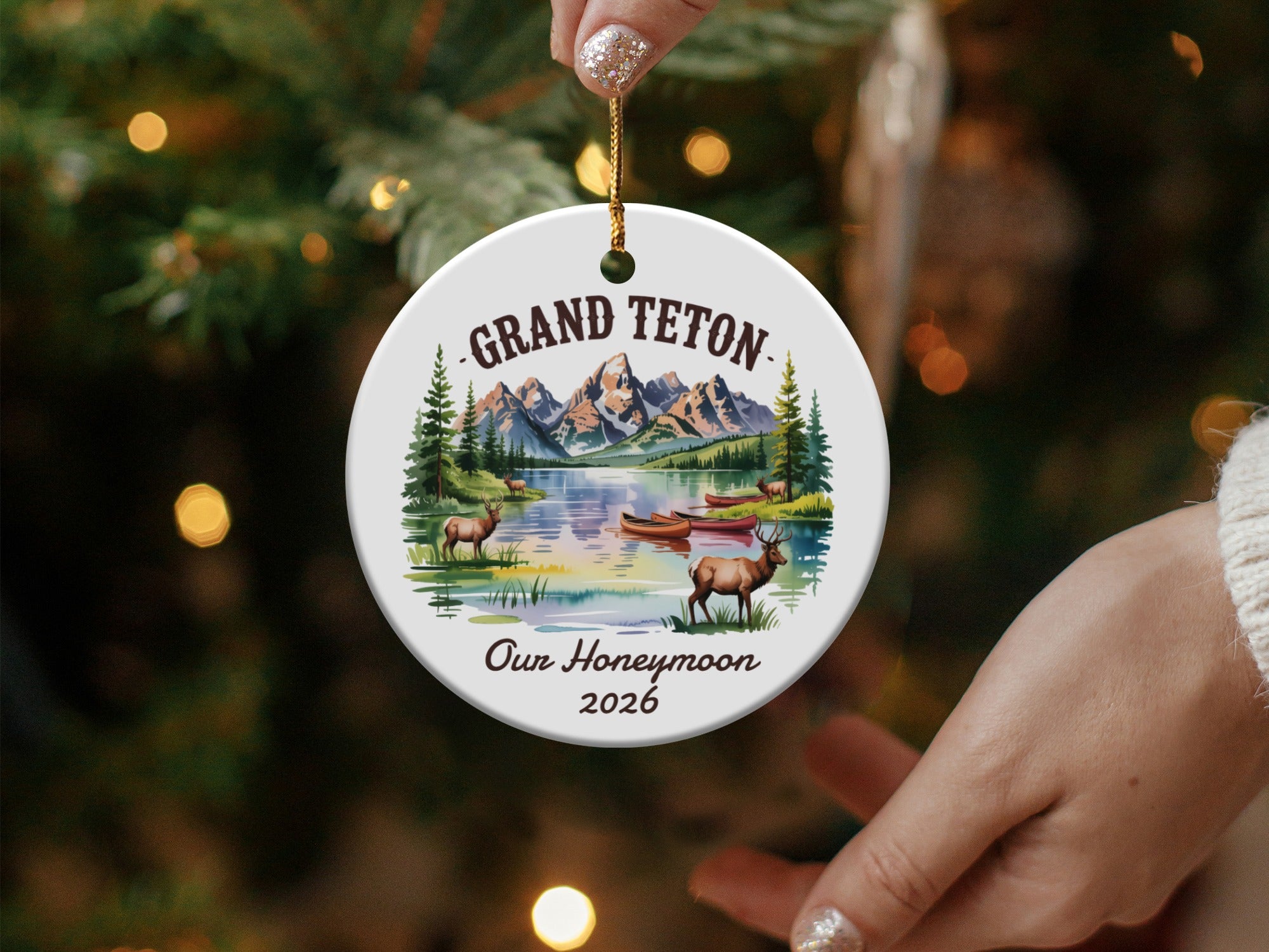 Grand Teton honeymoon ornament with lake, mountains, deer, and canoes.