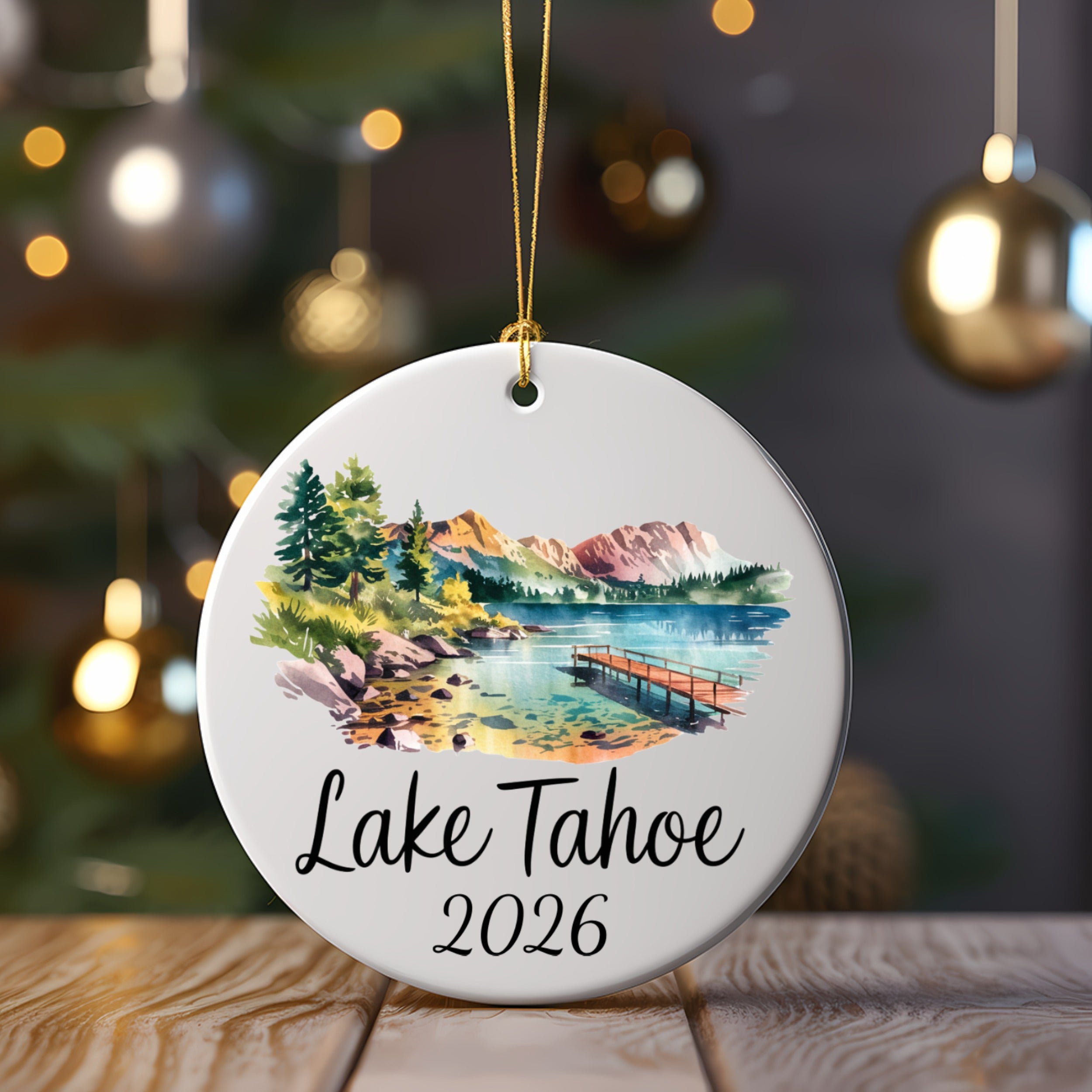 Lake Tahoe 2026 ornament with watercolor landscape and pier.