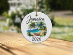 Round Jamaica 2026 ornament with palm trees and beach scene.