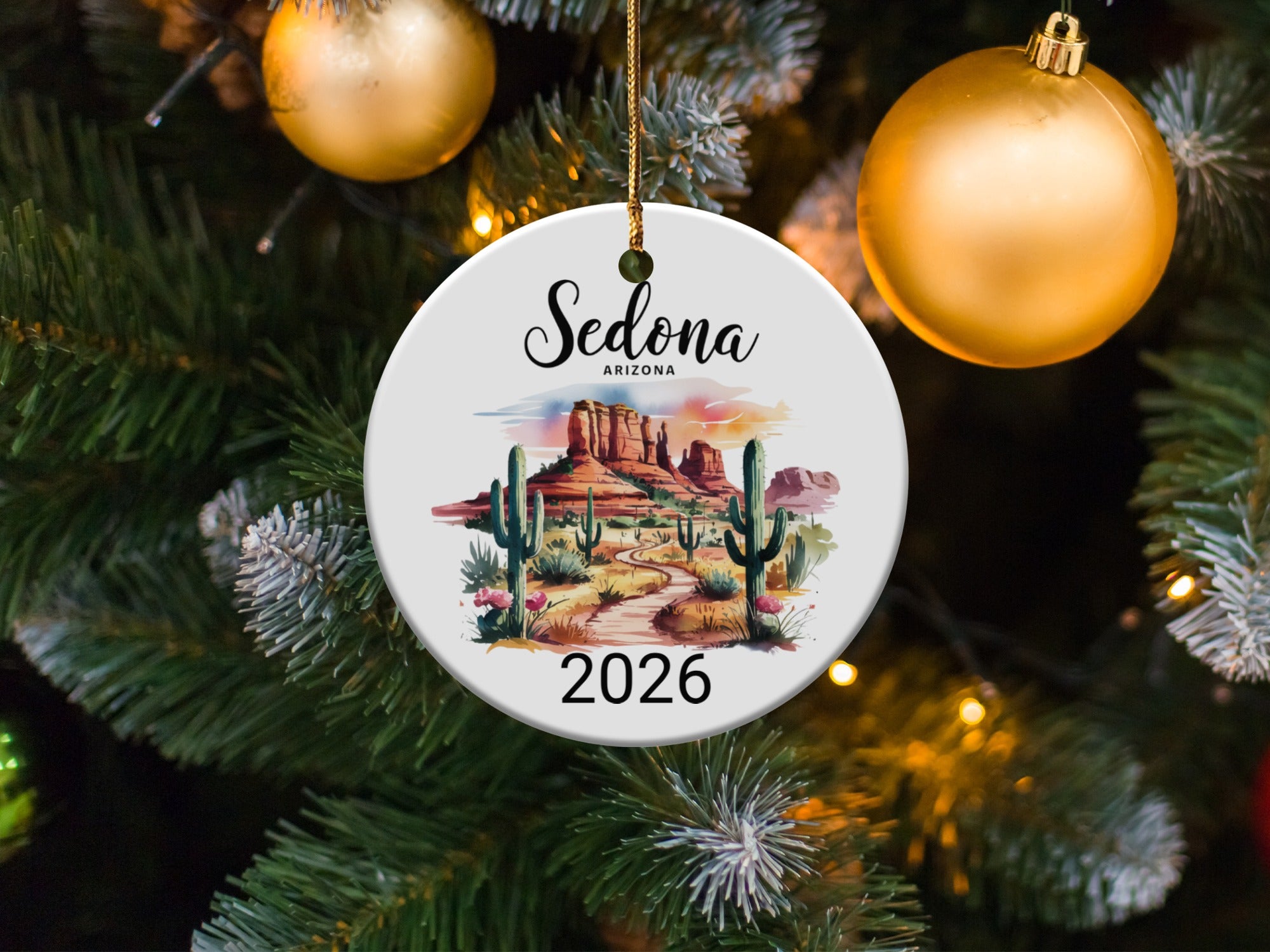 Sedona 2026 ornament with desert landscape and cacti.