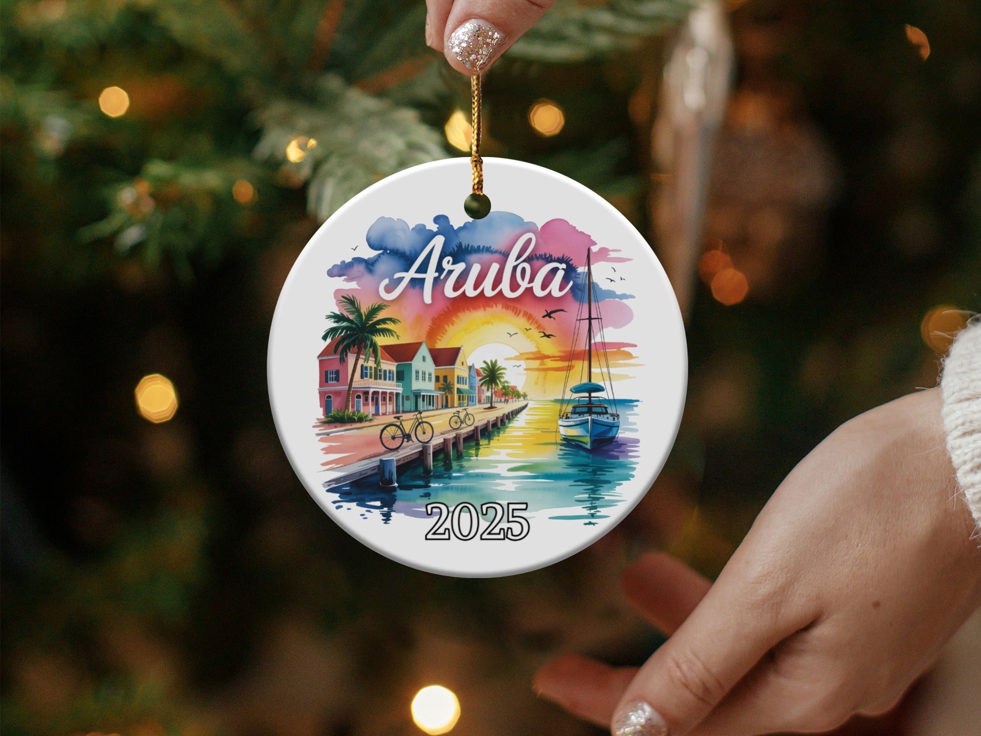 Round ornament with "Aruba 2025" and a vibrant Caribbean coastal scene.