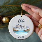 Round ornament featuring Chilean mountains, glacier, lake, and "2026".