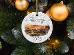 Tuscany 2026 ceramic ornament on a decorated Christmas tree.