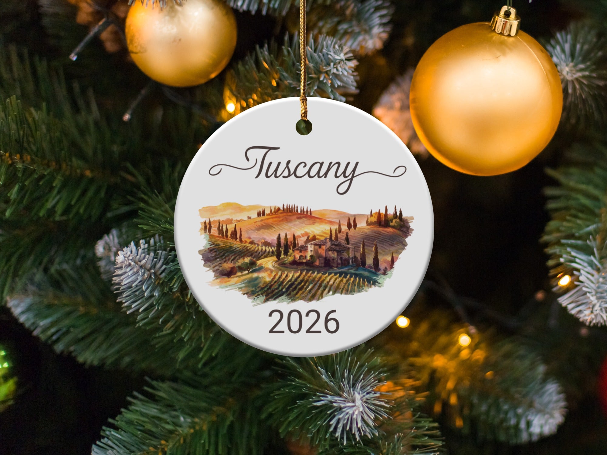 Tuscany 2026 ceramic ornament on a decorated Christmas tree.