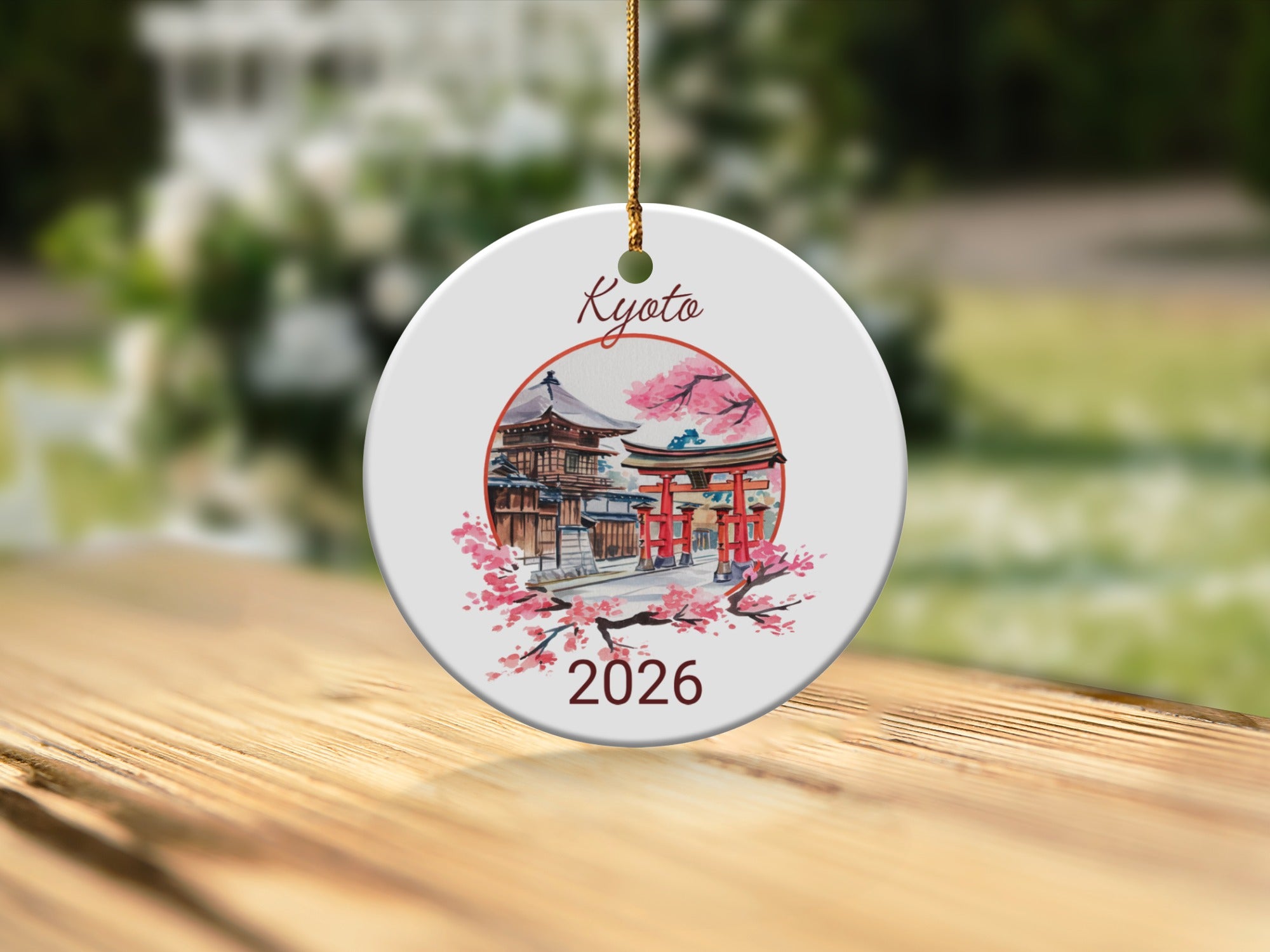 Kyoto 2026 ornament with a Japanese temple and cherry blossoms.