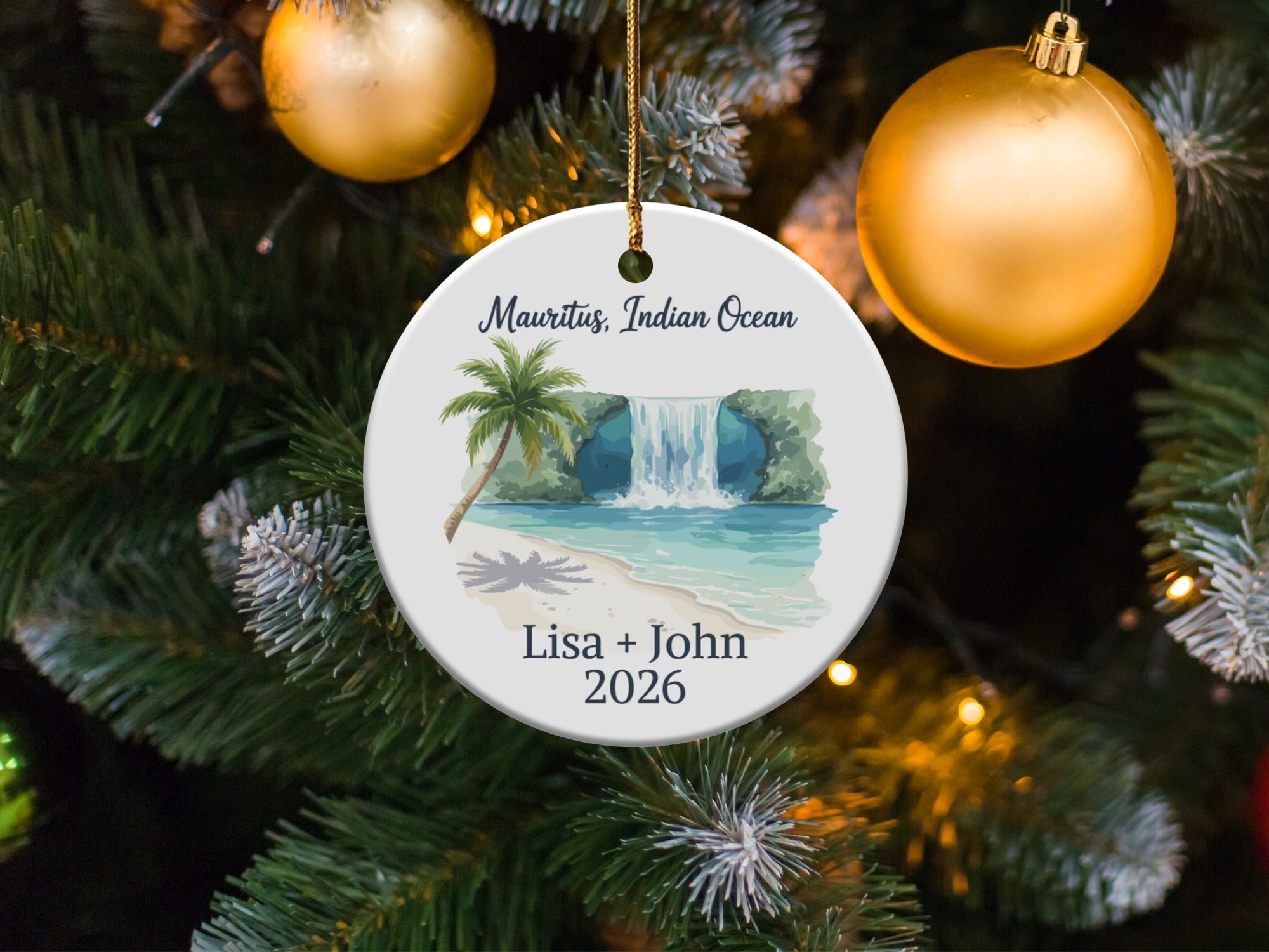 Round ornament featuring a tropical waterfall scene with text: "Mauritius, Indian Ocean, Lisa + John 2026".