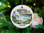 Niagara Falls 2026 ceramic Christmas ornament with rainbow and people.
