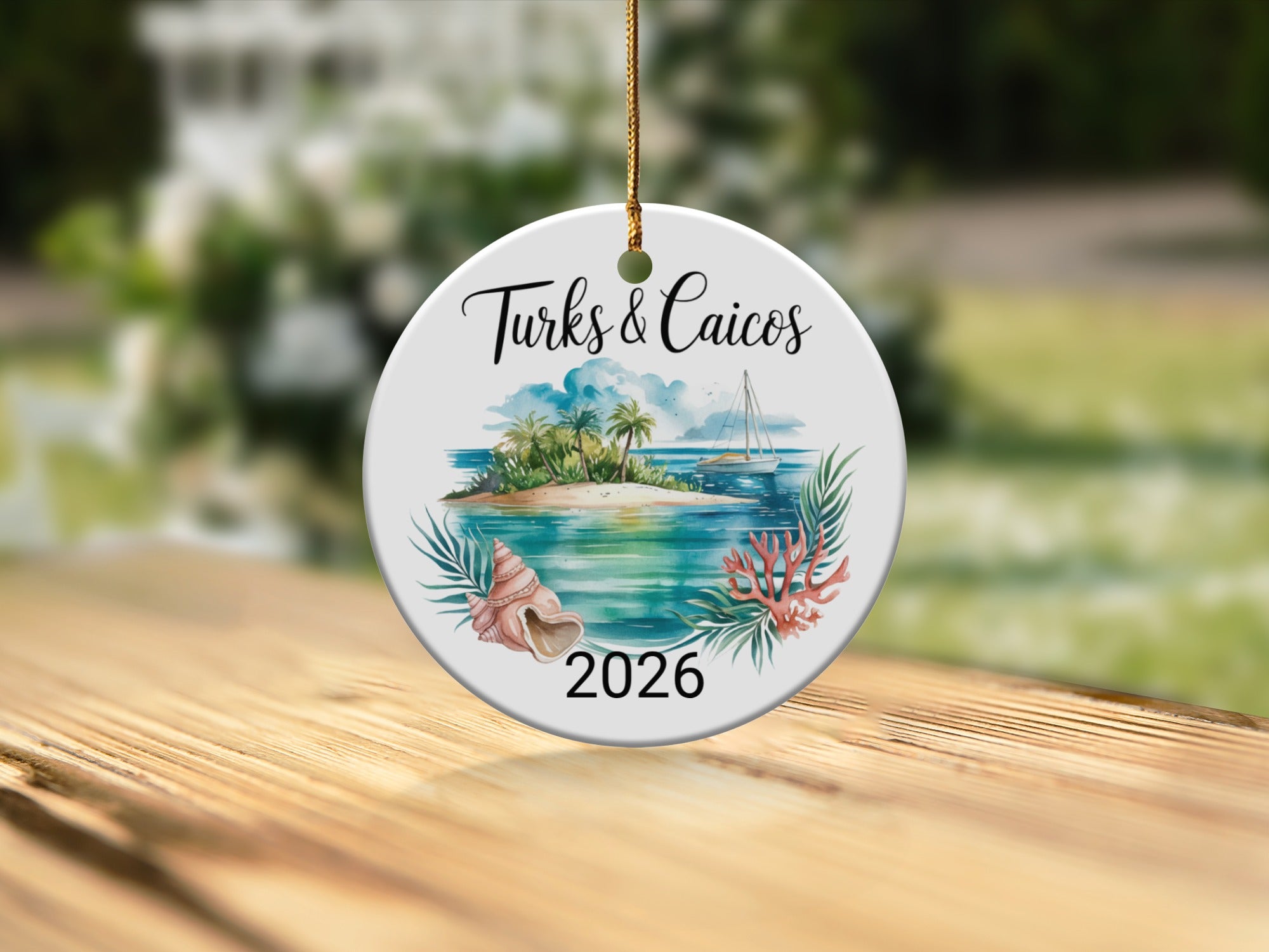 Turks & Caicos round ornament with a beach scene, sailboat, and coral.