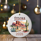 Round Sedona ornament with red rocks, cactus, and "2026" text.