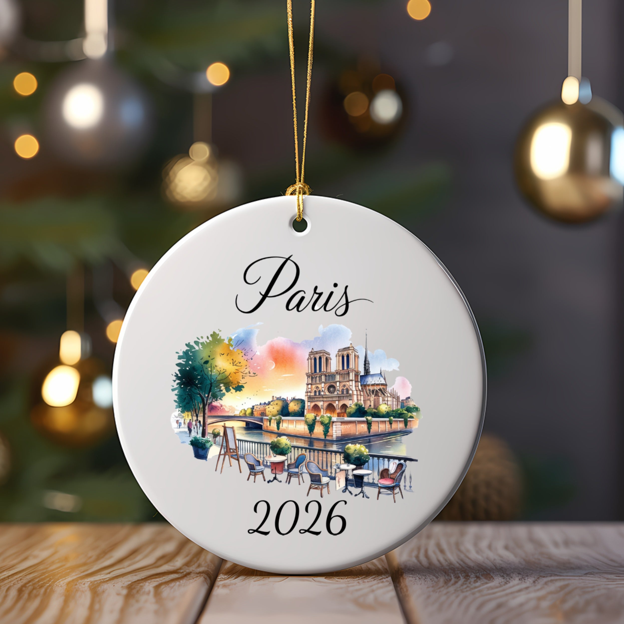 Circular ornament with watercolor of Notre Dame and Seine river, "Paris 2026".