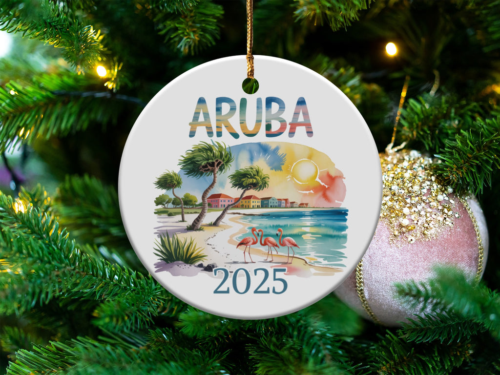 Round ARUBA 2025 ornament with beach scene and flamingos.