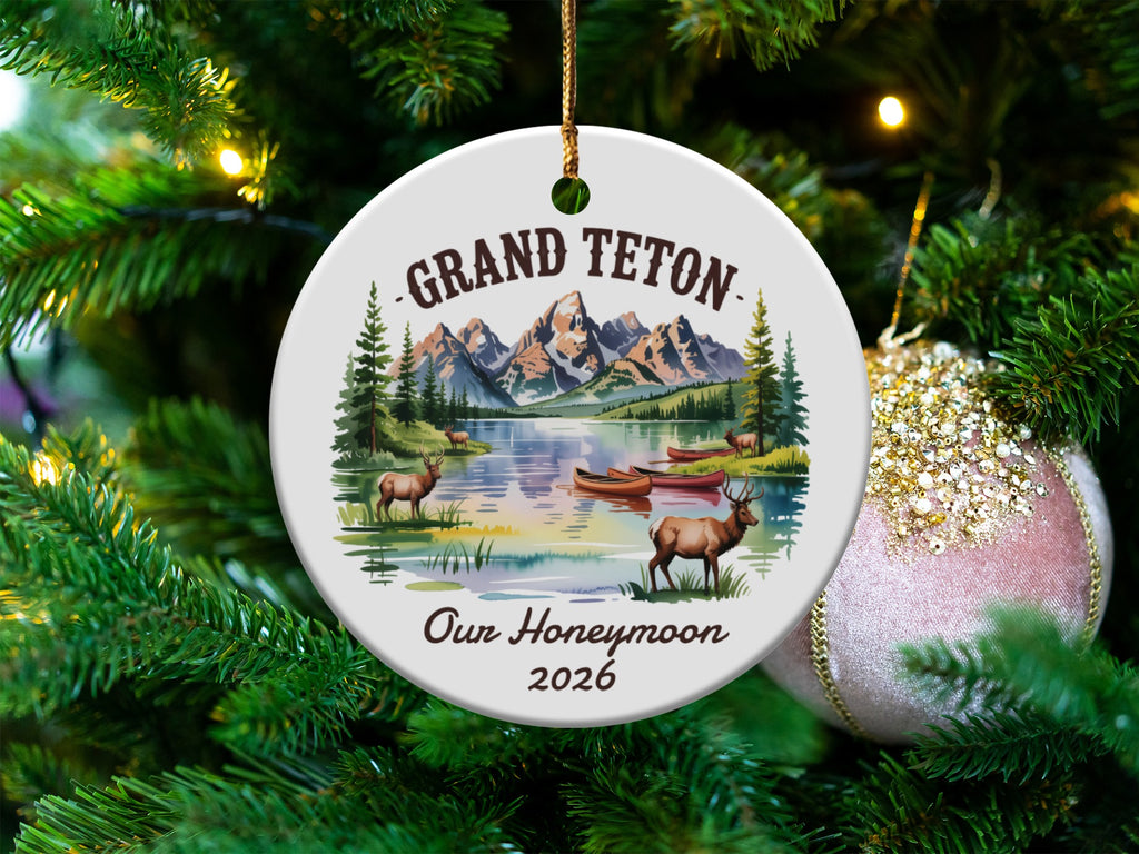 Grand Teton honeymoon ornament with lake, mountains, canoes, and deer.