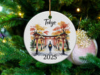 Round ornament with Tokyo gate scene and 2025 date.