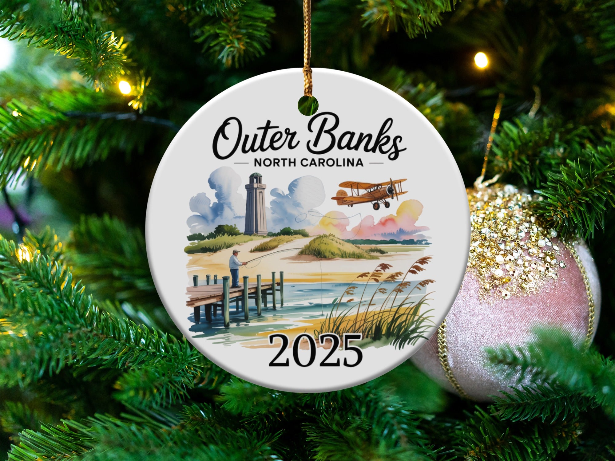 Outer Banks North Carolina ornament with lighthouse, pier, and biplane.