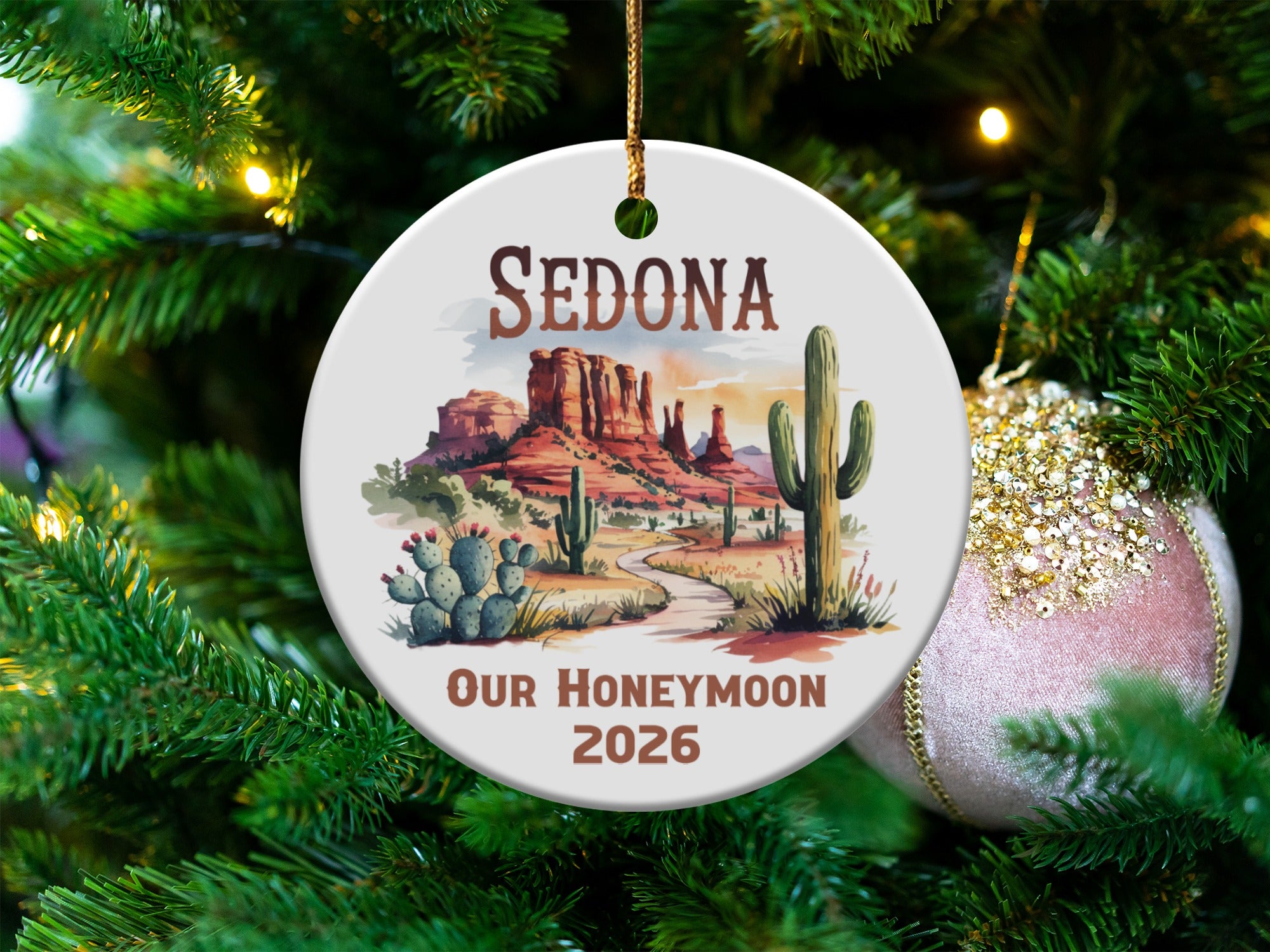 Sedona honeymoon ornament with red rocks, cactus, and text "Sedona Our Honeymoon 2026".