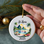 Round ceramic ornament with St. Lucia scene, palm trees, mountains, and the year 2025.