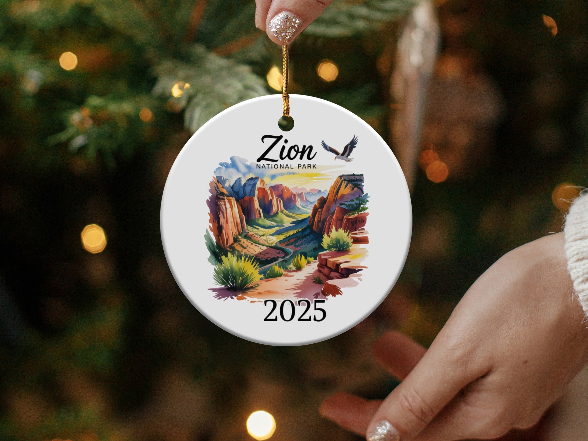 Round ceramic ornament with Zion National Park landscape and "2025".