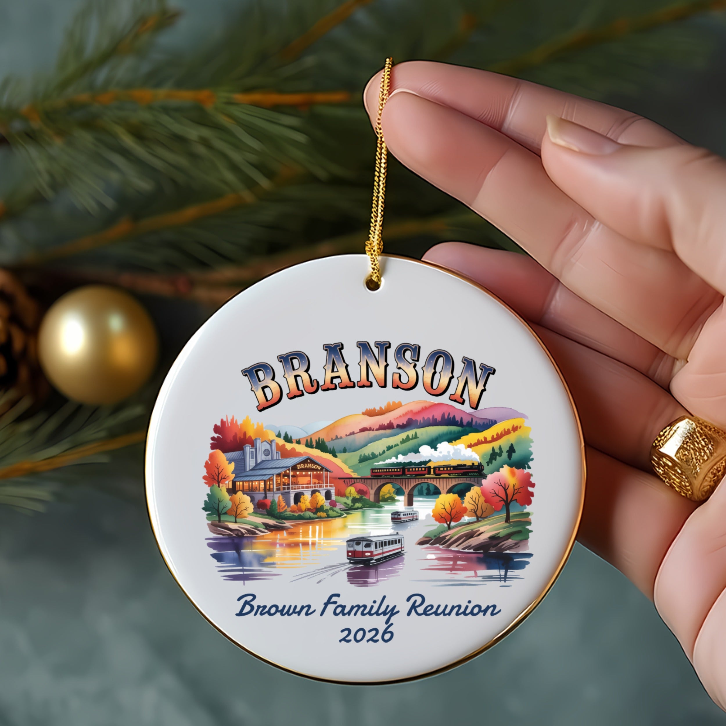 Round ceramic ornament with "Branson Brown Family Reunion 2026" and autumn scene.