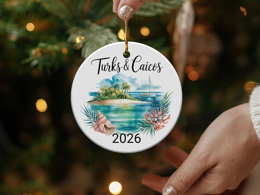 Turks & Caicos 2026 ornament with a beach, palm trees, boat, and coral.
