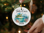 Turks & Caicos 2026 ornament with a beach, palm trees, boat, and coral.