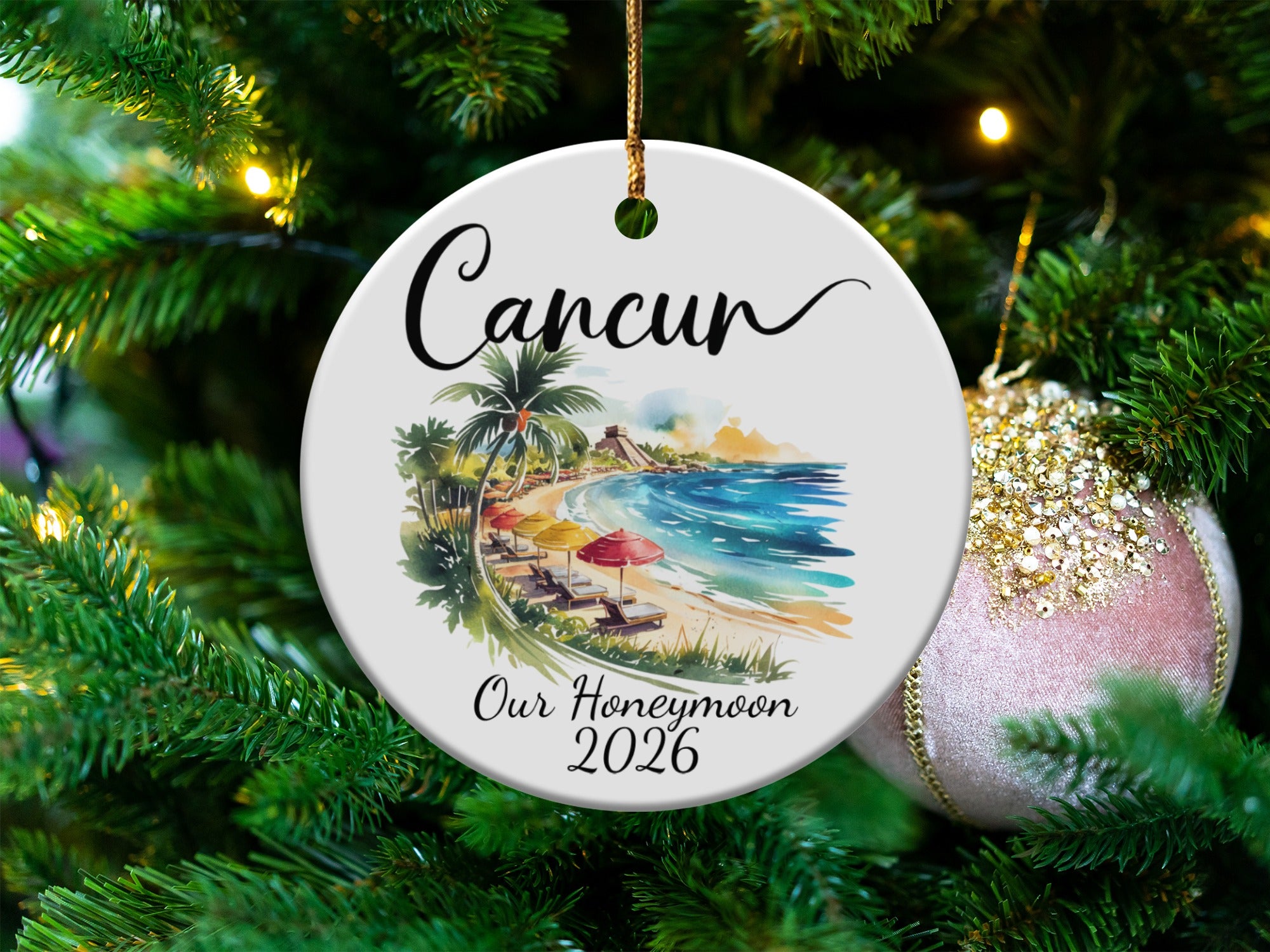 Round ornament with Cancun beach scene and "Our Honeymoon 2026".