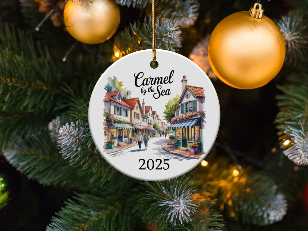 Carmel by the Sea 2025 ornament with buildings and Christmas tree background.