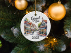 Carmel by the Sea 2025 ornament with buildings and Christmas tree background.