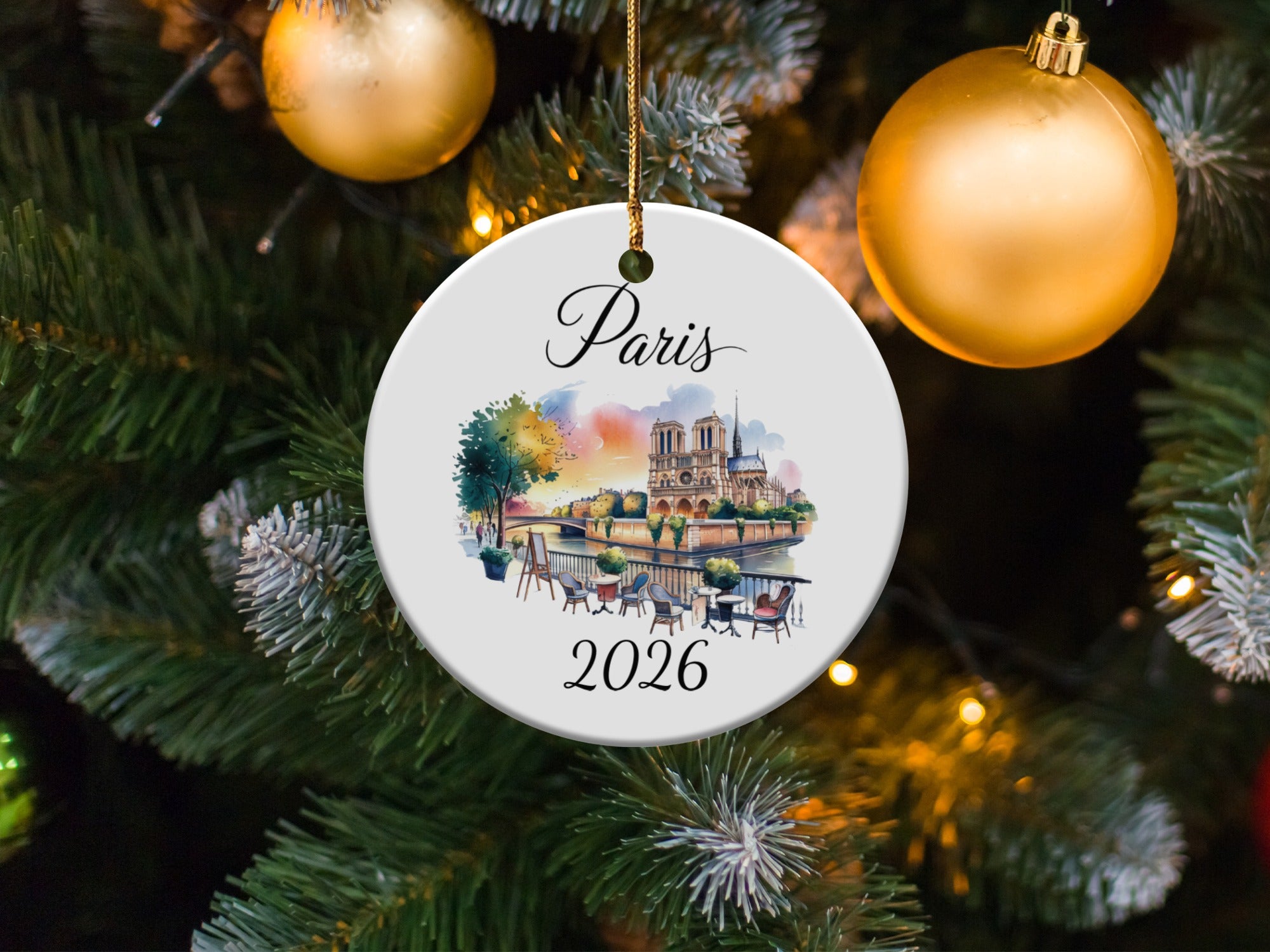 Paris 2026 ceramic ornament with Notre Dame cathedral, decorated Christmas tree.