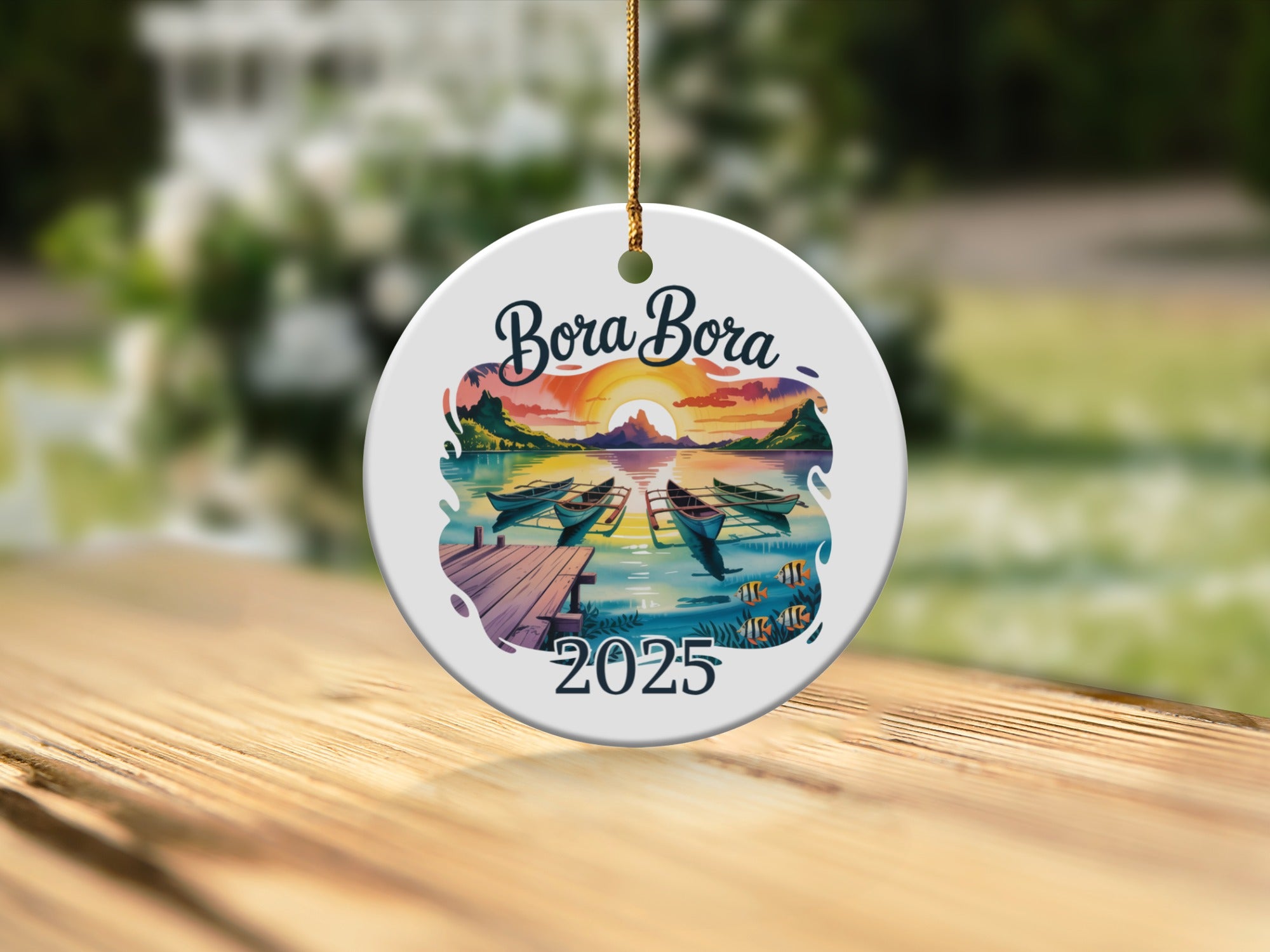 Bora Bora 2025 ornament with boats on water at sunset.
