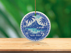 Round ceramic ornament with Bora Bora, French Polynesia scene and palm trees.