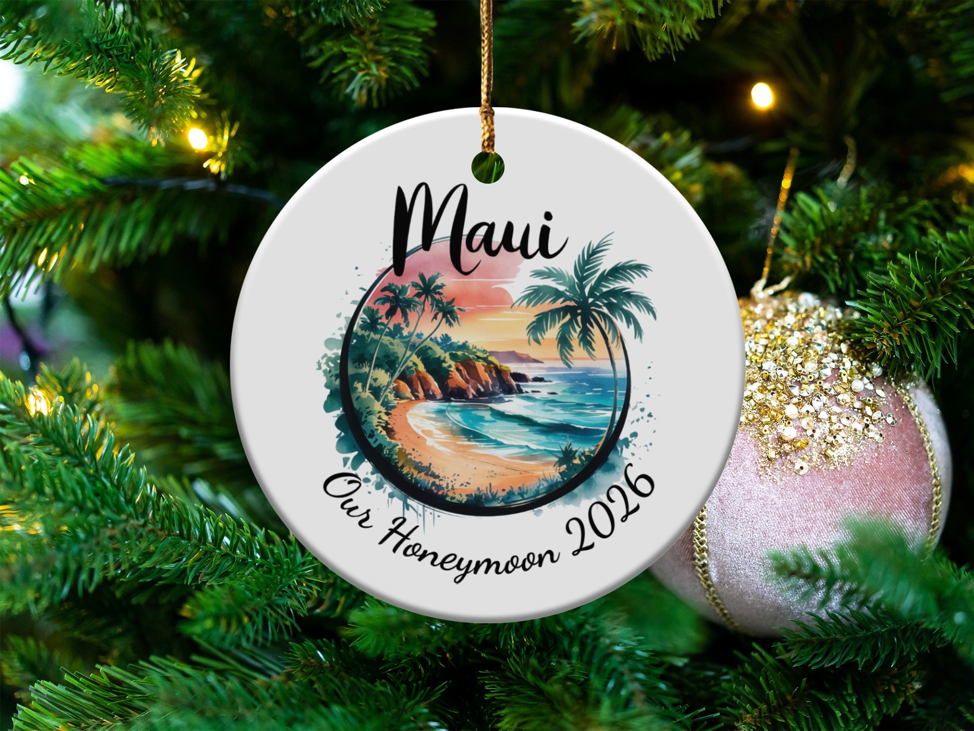 Round ornament with tropical beach scene and "Maui Our Honeymoon 2026" text.