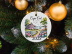 Cape Cod Massachusetts 2025 ceramic ornament with house, fence, and ocean view.