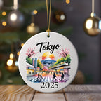 Tokyo 2025 ceramic ornament featuring cityscape with cherry blossoms and train.