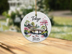 Circular Tokyo ornament with bridge, pagoda, cherry blossoms, and koi fish.