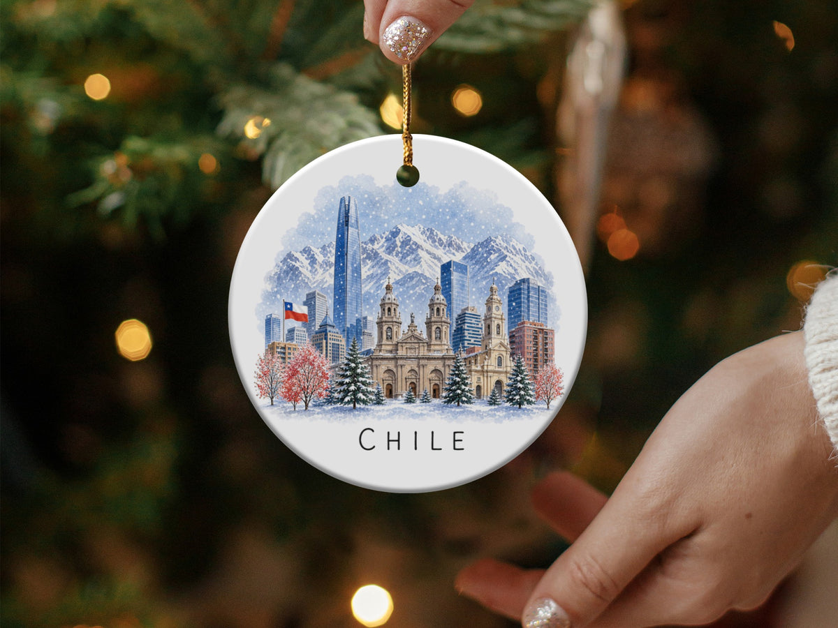 Ornament featuring a snowy cityscape of Chile with mountains and the word "CHILE".