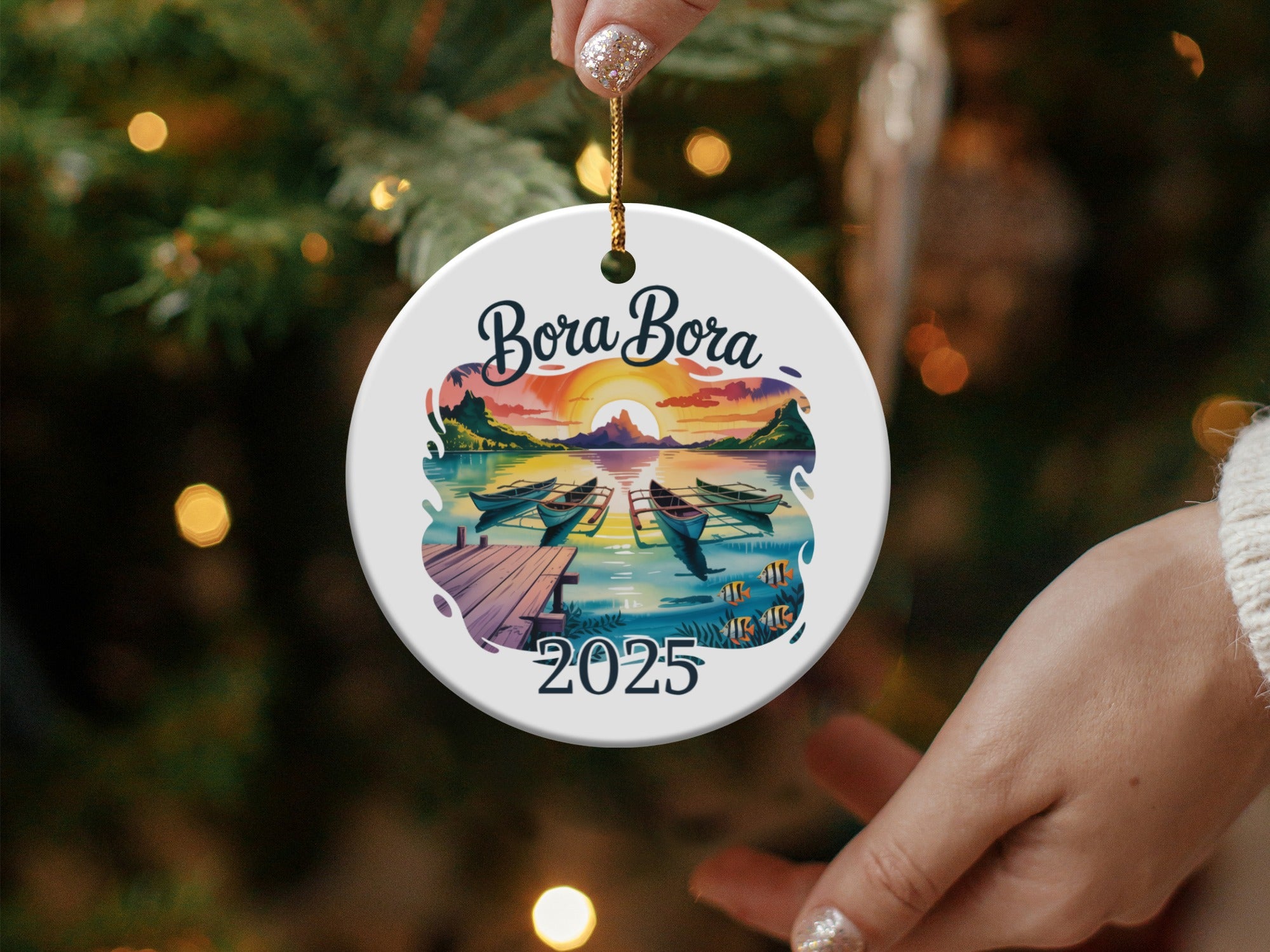 Bora Bora 2025 ornament with boats and sunset over water.